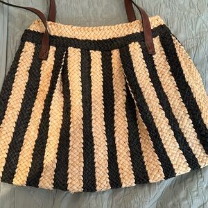 Black and tan striped raffia bag. Fully lined with inner pocket. Like new.
